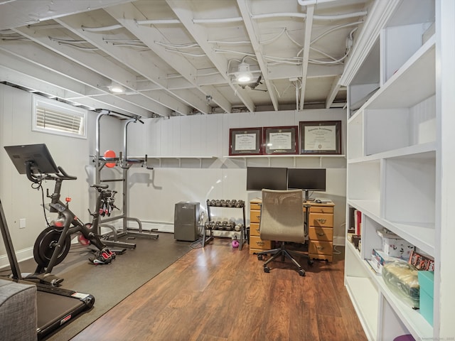 office area with a baseboard radiator and wood finished floors