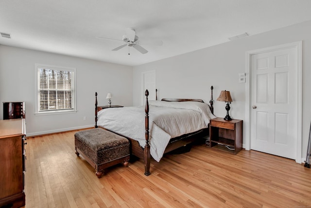 bedroom with visible vents, ceiling fan, light wood-type flooring, and baseboards