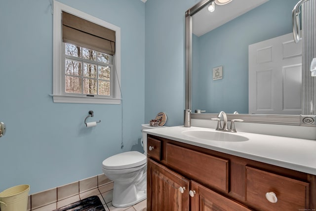 bathroom featuring tile patterned floors, toilet, and vanity