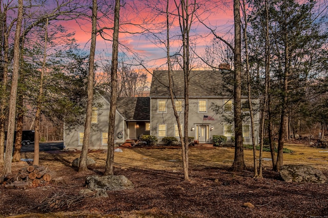 exterior space with a shingled roof