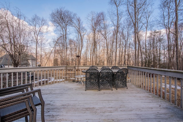 wooden terrace featuring outdoor dining space