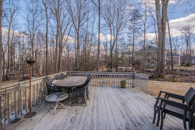 wooden terrace with outdoor dining area