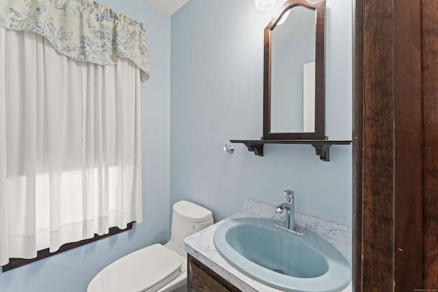 bathroom with vanity and toilet