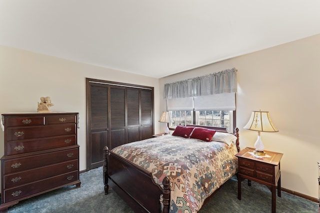 bedroom featuring a closet, baseboards, and dark carpet