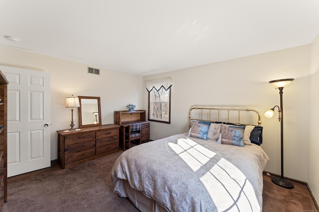 carpeted bedroom featuring visible vents and baseboards