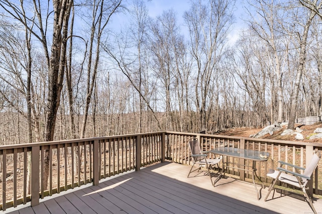 wooden terrace with outdoor dining space