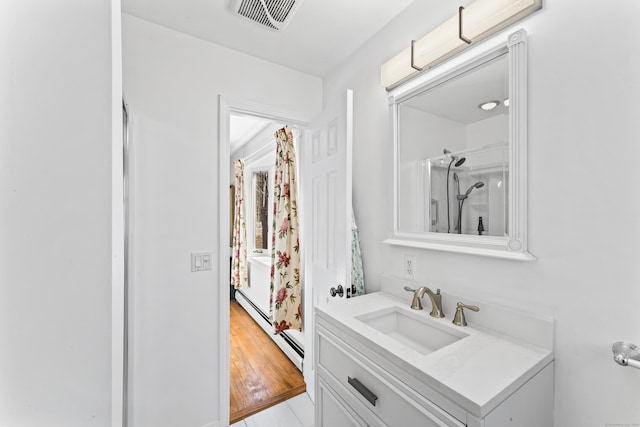 bathroom featuring visible vents and vanity