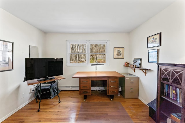 office with wood finished floors, baseboards, and baseboard heating