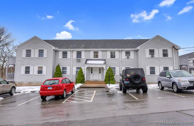 view of front facade with uncovered parking