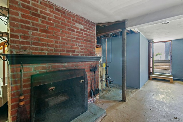 9 Waters Ave, Rocky Hill, CT 06067 - unfurnished living room with a brick fireplace, unfinished concrete floors, and stairway