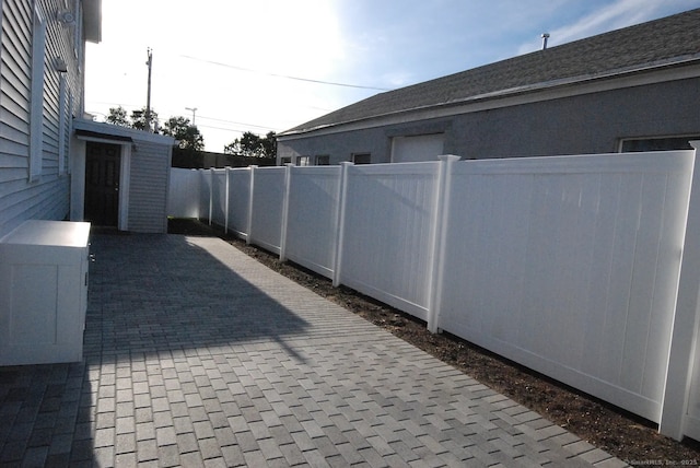 view of patio / terrace featuring fence