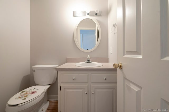 bathroom with vanity and toilet