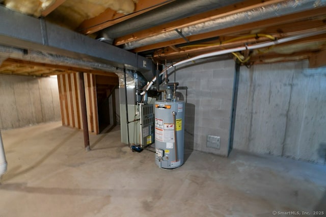 unfinished basement featuring heating unit and gas water heater