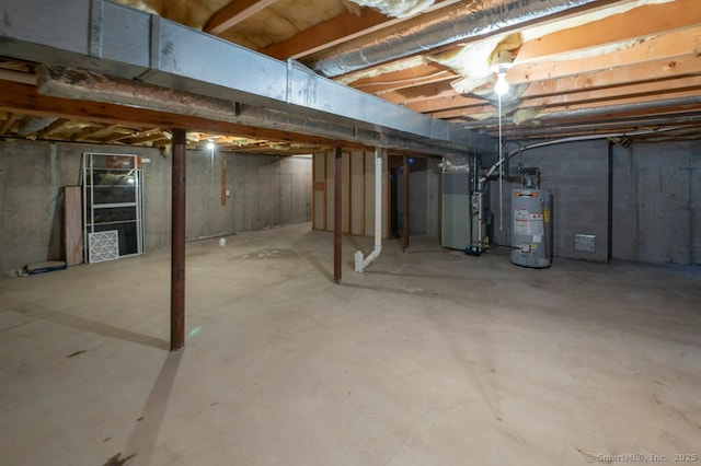 unfinished basement with heating unit and water heater