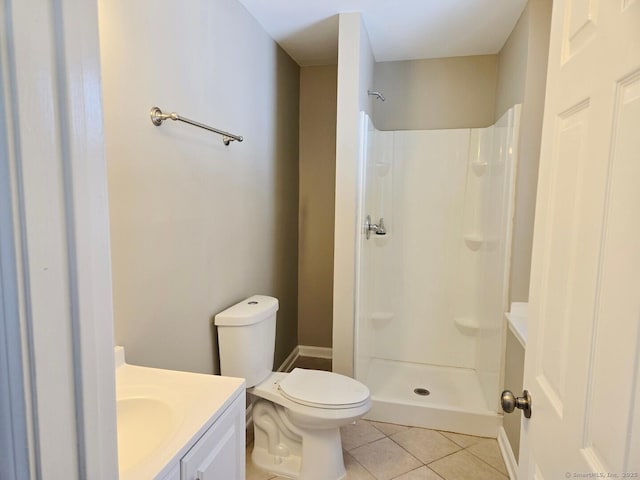 full bath with a shower, vanity, toilet, and tile patterned floors