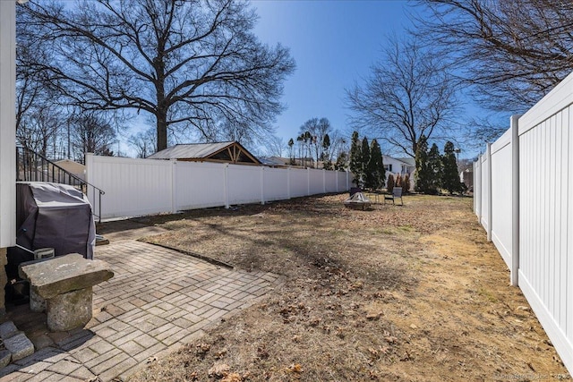 view of yard with a patio and a fenced backyard