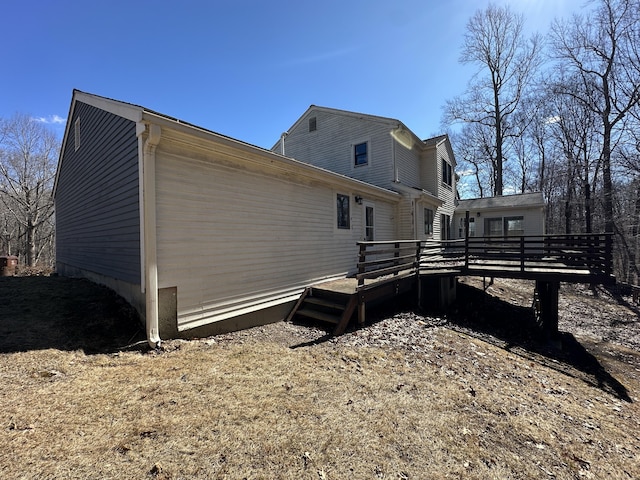 view of property exterior featuring a deck