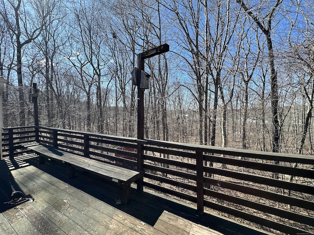 deck featuring a view of trees