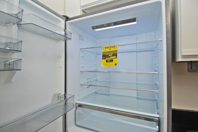 interior details featuring refrigerator