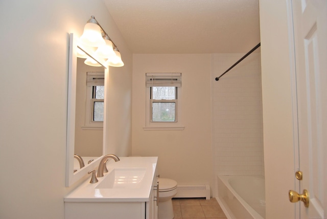 bathroom featuring toilet, a baseboard heating unit, vanity, shower / washtub combination, and tile patterned floors