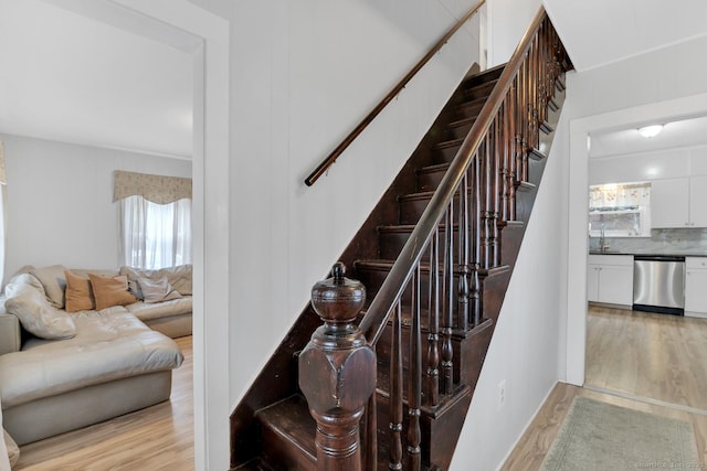 stairs with wood finished floors