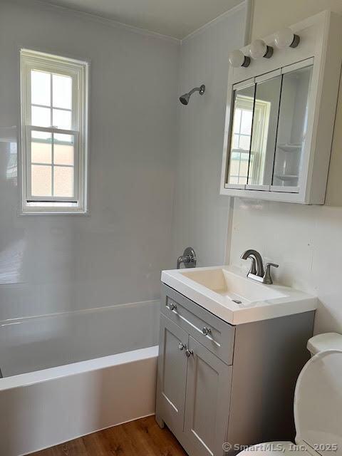 full bath with toilet, shower / washtub combination, and vanity