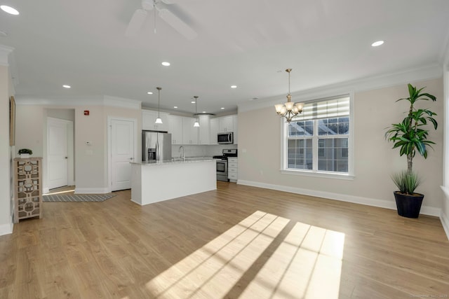 kitchen featuring a sink, white cabinets, light countertops, appliances with stainless steel finishes, and light wood-type flooring