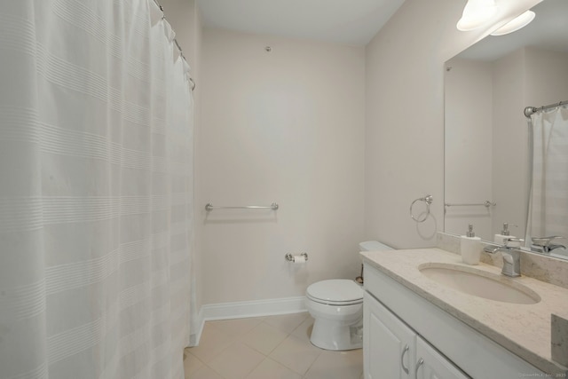 full bath featuring baseboards, vanity, toilet, and tile patterned floors