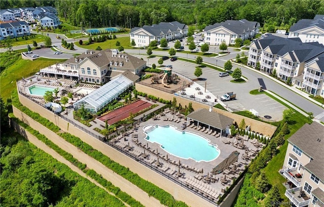 birds eye view of property with a residential view