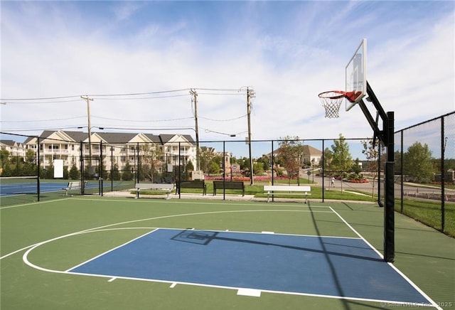 view of sport court featuring community basketball court and fence