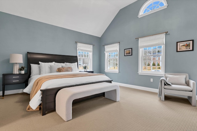 bedroom featuring high vaulted ceiling, carpet, and baseboards