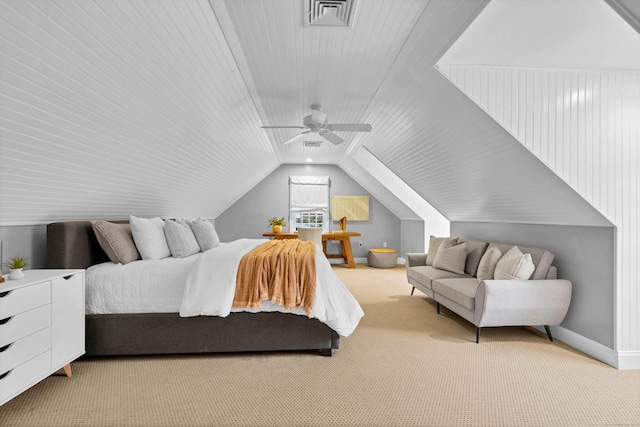 carpeted bedroom featuring ceiling fan, visible vents, vaulted ceiling, and baseboards