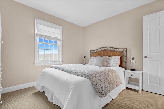 carpeted bedroom with baseboards