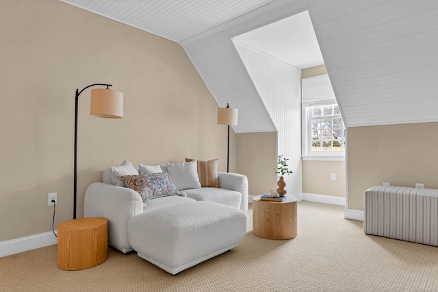 living area with baseboards, carpet, and radiator