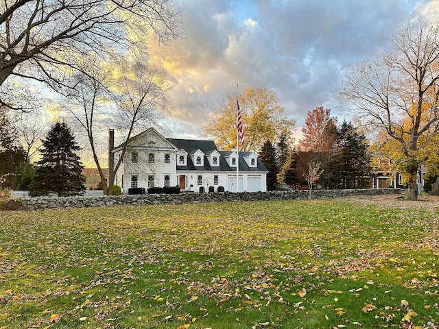 exterior space featuring a yard and a chimney