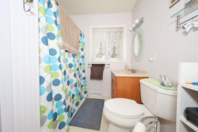 bathroom with vanity, tile walls, toilet, and a shower with shower curtain