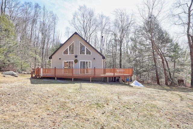 back of house with a yard and a wooden deck