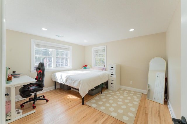 bedroom featuring recessed lighting, baseboards, and light wood-style floors