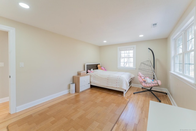 bedroom featuring recessed lighting, visible vents, baseboards, and light wood-style floors