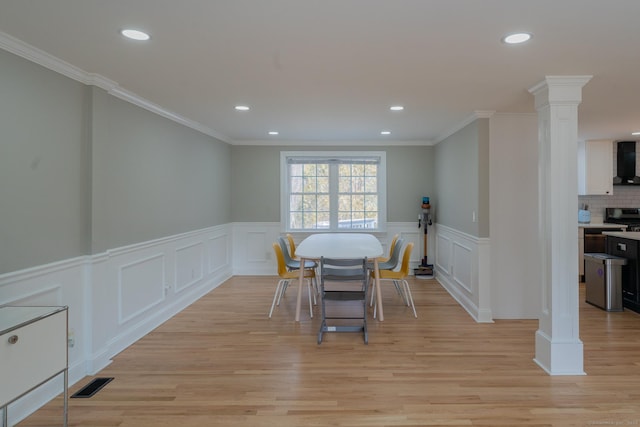 dining space with decorative columns, recessed lighting, visible vents, and light wood-type flooring