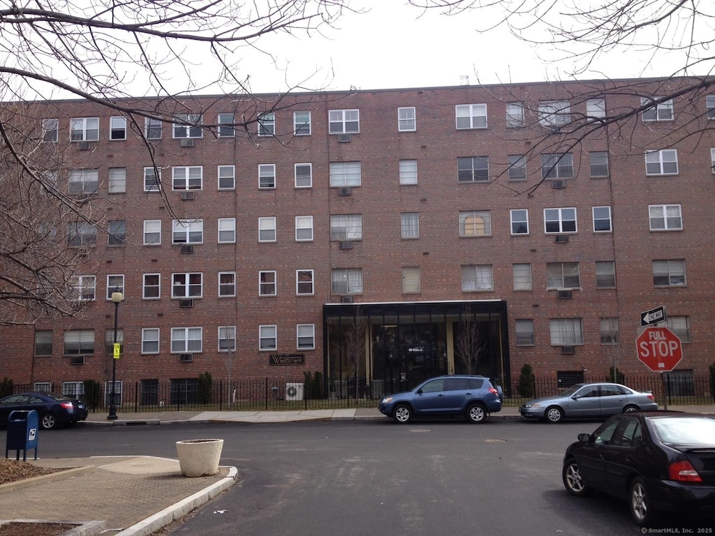 view of building exterior featuring fence