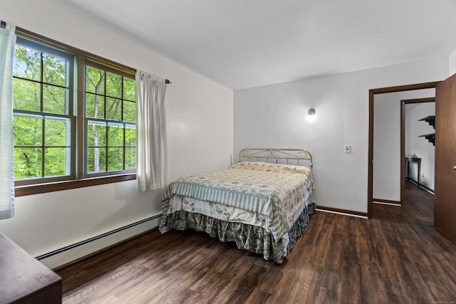 4 Wildwood Ln, Weston, CT 06883 - bedroom featuring a baseboard radiator, wood finished floors, and baseboards