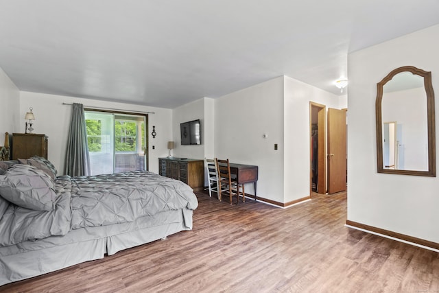 4 Wildwood Ln, Weston, CT 06883 - bedroom featuring wood finished floors, access to exterior, and baseboards