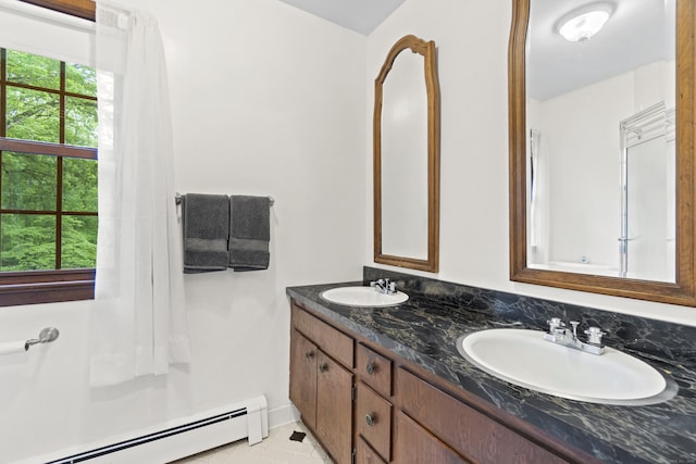 4 Wildwood Ln, Weston, CT 06883 - bathroom featuring baseboard heating, double vanity, and tile patterned flooring