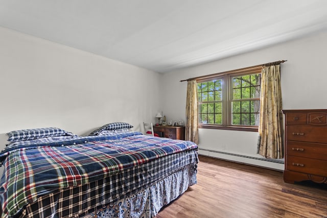 4 Wildwood Ln, Weston, CT 06883 - bedroom with baseboard heating and wood finished floors