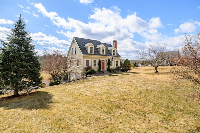 cape cod home featuring a front yard and a chimney