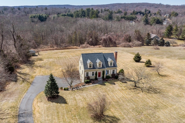 birds eye view of property with a forest view