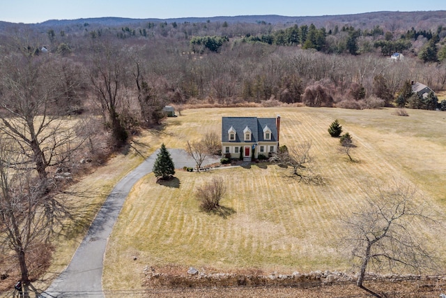 birds eye view of property with a wooded view