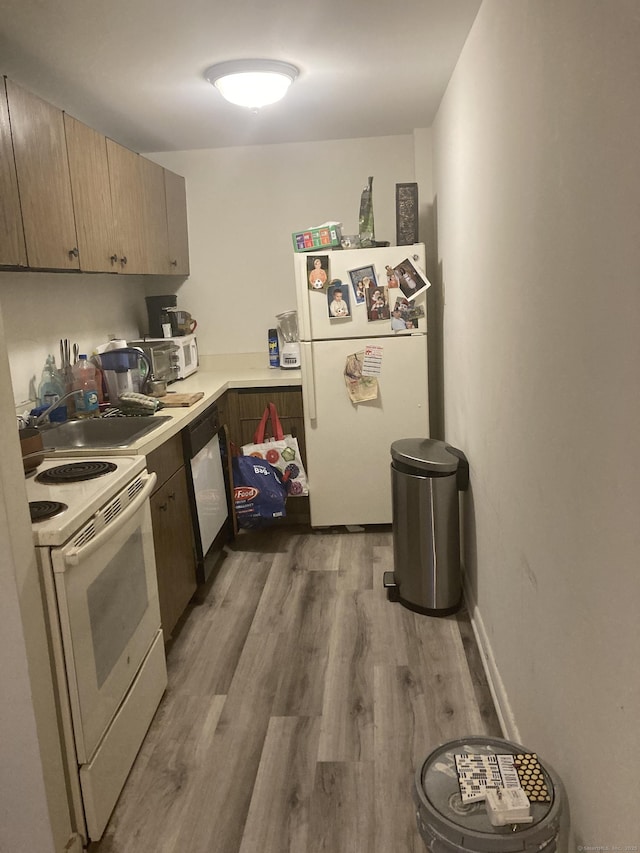 40 Owen St Apt B5, Hartford, CT 06105 - kitchen featuring white appliances, wood finished floors, and light countertops