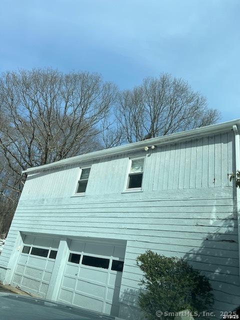 view of side of home with a garage